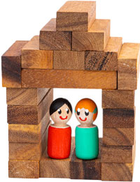 Two wooden figurines standing together
