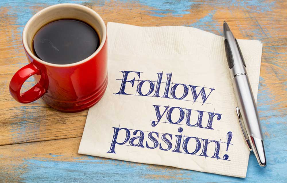 Image of a coffee cup, pen, and hand written note saying follow your passion